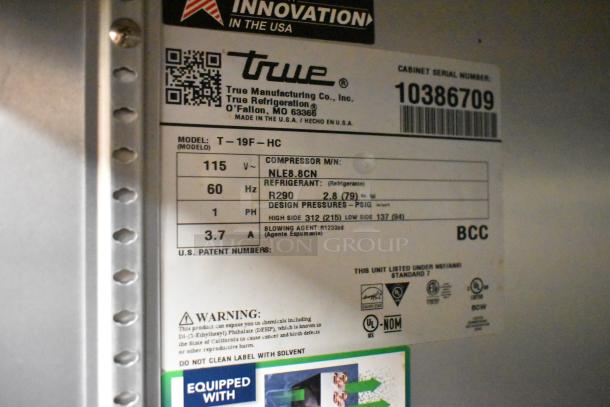 Label on a 2022 True T-19F-HC commercial freezer; shows model, voltage (115V), phase (1), refrigerant (R290), and safety warnings.