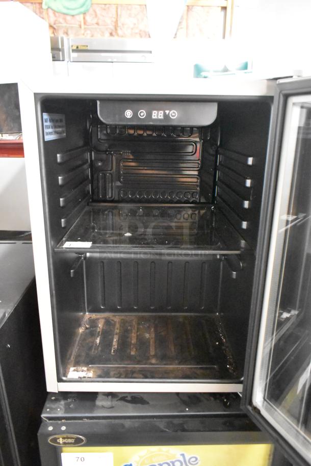 2022 Frigidaire EFMIS9000 mini cooler merchandiser, metal finish, visible interior shelves, digital temperature display, 115V.