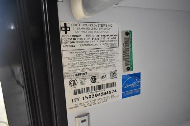 QBD DC6LP Metal Mini Cooler Merchandiser; 115V, 1 Phase. Model info, serial number, and Energy Star label visible.