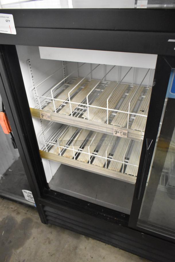 2019 True GDM-41SL-48-HC-LD cooler with metal 2 doors, poly-coated racks, and visible shelving labels. 115 volts, 1 phase.