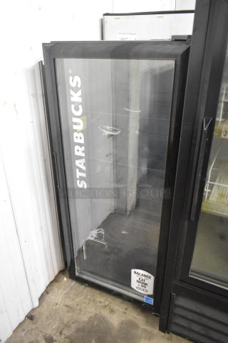 2020 IDW G4-H0234B metal single door cooler, clear glass with "Starbucks" branding, intact but showing wear.