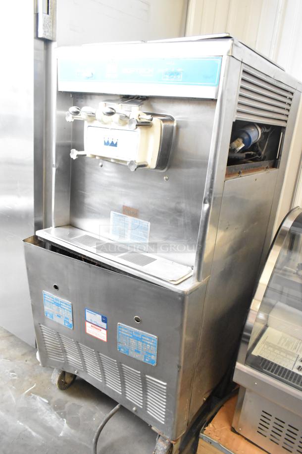 Taylor 754-27 stainless steel soft serve ice cream machine, 2 flavors with twist, on commercial casters, 208-230V, 1 phase.