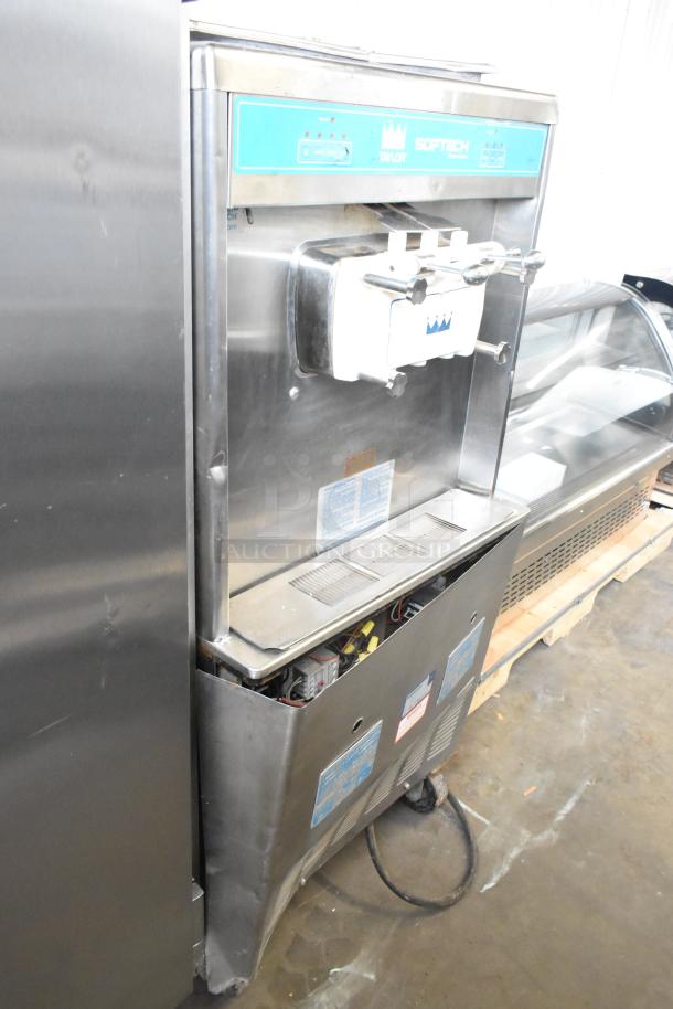 Taylor 754-27 stainless steel soft serve ice cream machine, 2 flavors with twist, commercial casters, 208-230V, 1 phase.