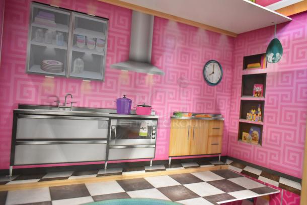Doll playhouse kitchen scene with pink geometric walls, modern metallic sink and oven, cabinets, and clock. Good condition.