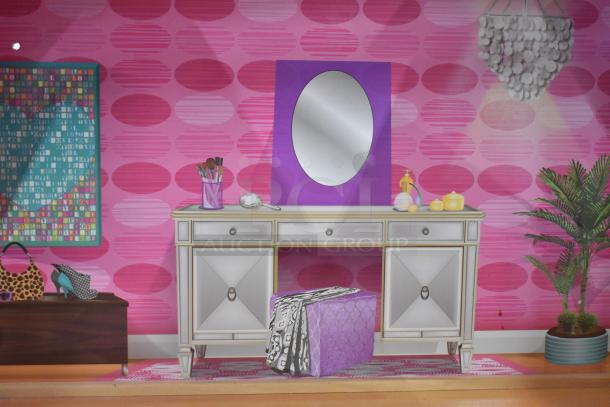 Doll playhouse interior with vanity table, mirror, pink wallpaper, decorative items, and a plant. Vibrant and colorful design.