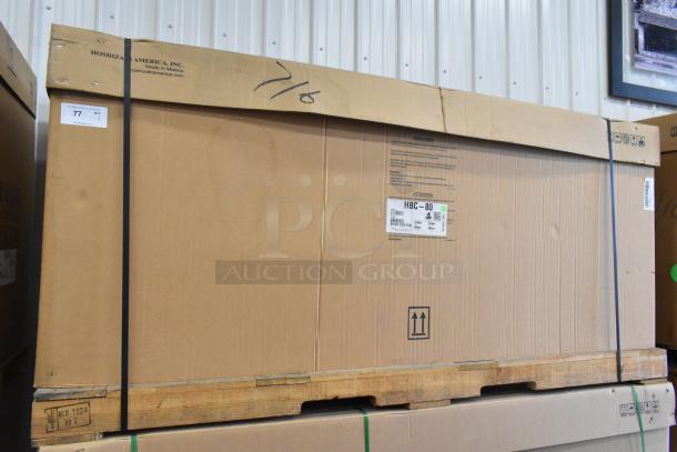 Brand new Hoshizaki HBC-80 metal back bar cooler in box, 115 volts, 1 phase. Box labeled with model and brand.