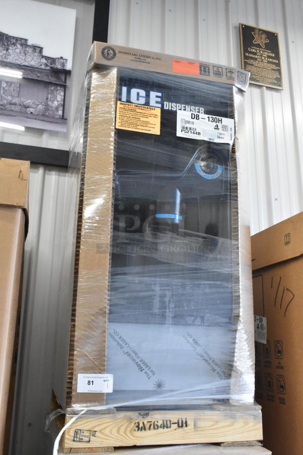 Brand new Hoshizaki DB-130H stainless steel commercial ice dispenser in box, 130 lb storage, 115 volts, 1 phase. Model label visible.