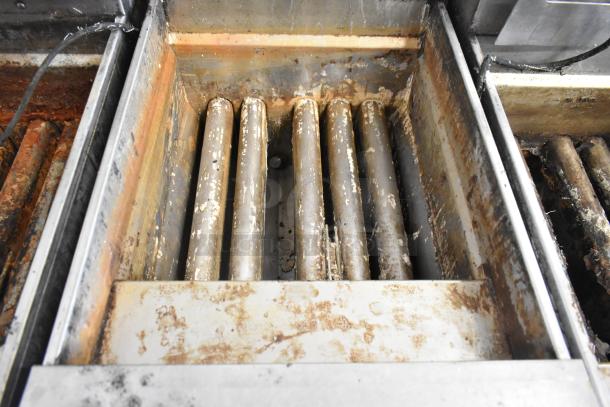 Pitco Frialator SSH75 deep fat fryer interior, showing wear and residue. Stainless steel, 105,000 BTU, natural gas powered.