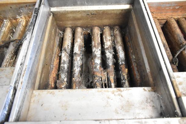 Pitco Frialator SSH75 Solstice Supreme fryer interior showing heating elements and signs of wear. Natural gas, 105,000 BTU.