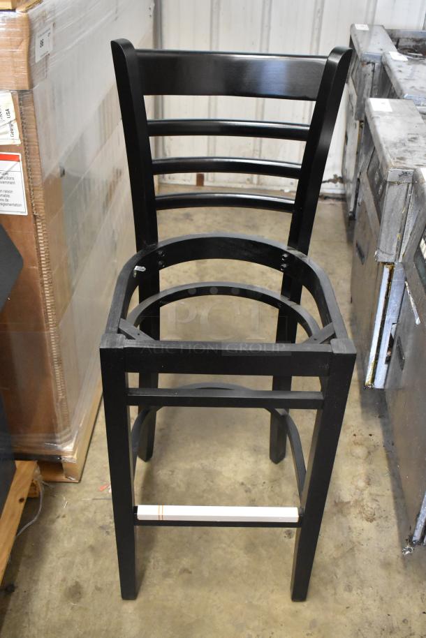 Black bar height ladder back chair by Lancaster Table & Seating, model 164BLADBLKFR, new with scratch and dent imperfections.