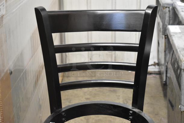 Brand new Lancaster black bar height ladder back chair with seat, featuring minor scratches and dents.
