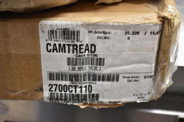 Cardboard box labeled "CAMTREAD 2700CT110," containing 6 Camtread 22"x27" black non-skid oval serving trays, new condition.