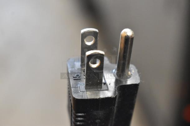 Close-up of a standard two-prong electrical plug for True GDM-06-LD Mini Cooler Merchandiser, 115 Volts, 1 Phase.