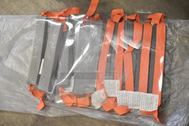 Lot of straps with red ties, labeled as "Face Shield." Packaged in clear plastic. Good condition.