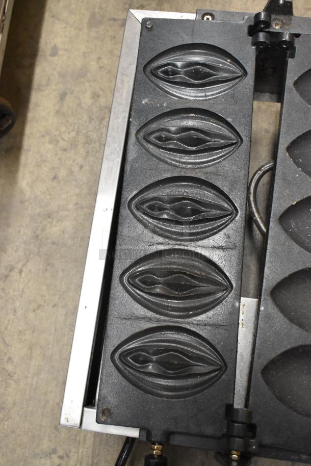 Stainless steel NP-257 commercial countertop waffle maker with four waffle molds. Runs on 110 volts, 1 phase.