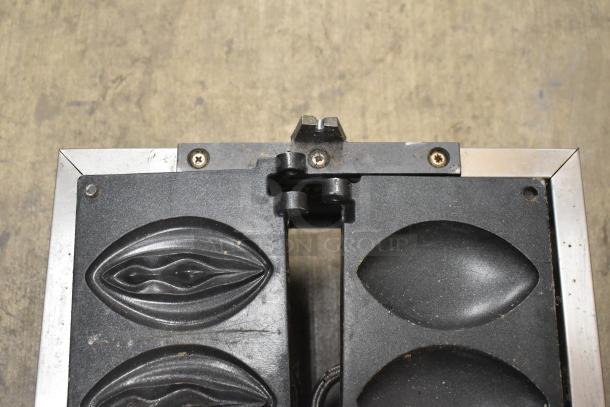 NP-257 Stainless Steel Commercial Countertop Waffle Maker, open view, showing unique mold design. Model NP-257, 110V, 1 Phase.