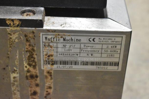 Stainless steel NP-257 commercial countertop waffle maker. 110V, 2.4KW, worn condition. Label includes model and specs.