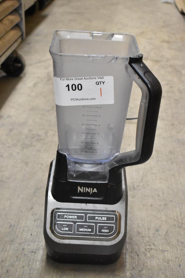 Ninja BL610 blender with pitcher, no lid, 120 volts, 1 phase. Auction tag visible, fair condition.