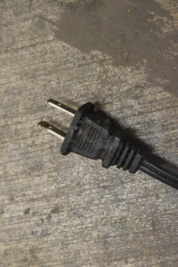Close-up of a power plug for a Ninja BL610 Blender. No lid, 120 volts, single phase.