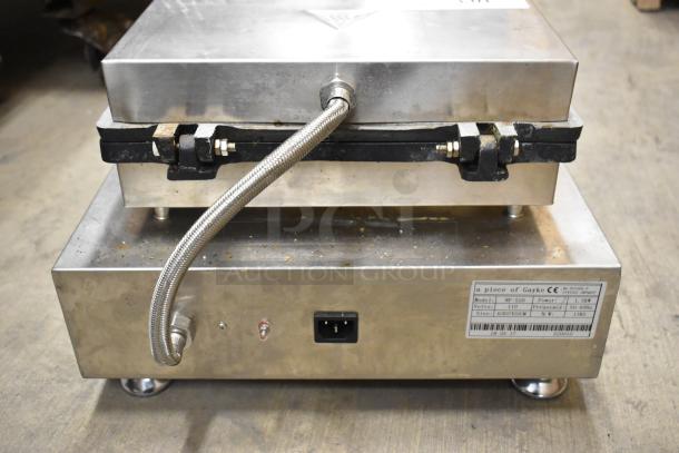 NP-520 stainless steel commercial waffle maker, countertop style, 110V, 1 phase. Visible wear. Model label included.