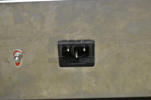 Stainless steel NP-520 waffle maker, 110V, with power socket and red tag. Commercial countertop model.