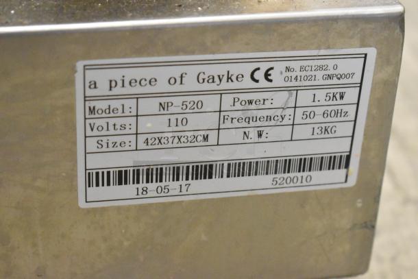 NP-520 stainless steel commercial countertop waffle maker, model NP-520, 110V, 1 phase, 1.5KW, label showing specs.