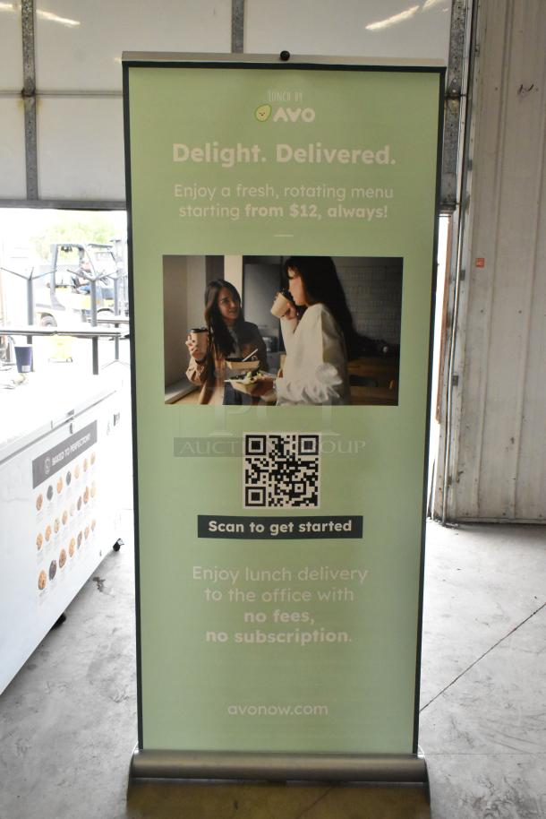 Roll-up sign for "Lunch by Avo" featuring delivery services, pricing, QR code, and promotional text.