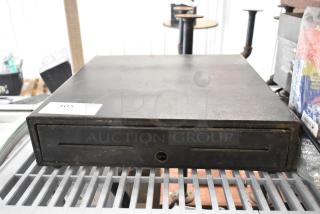 Evo EVO-CD18B black metal cash drawer, showing signs of wear, with front key slot and visible inventory tag labeled "105".