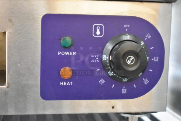 Stainless steel electric griddle control panel with settings, power, and heat indicators. 110 volts, 1 phase.
