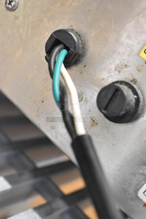 Stainless steel electric griddle wire connections; 110V, 1 Phase; minor wear visible; suitable for commercial use.