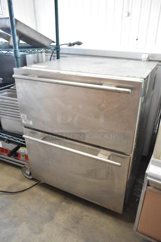 Sub-zero 700BR-3 stainless steel 2-drawer cooler/freezer, 115 volts, 1 phase. Shows wear, with labeling on drawer fronts.