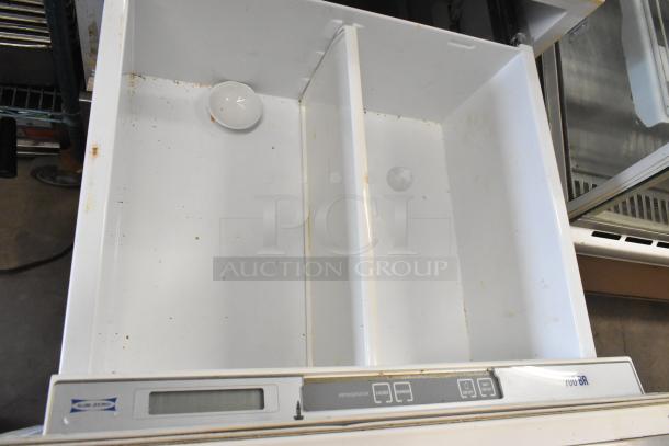 Sub-zero 700BR-3 stainless steel 2-drawer cooler/freezer, 115V, 1-phase, interior stains, front control panel visible.