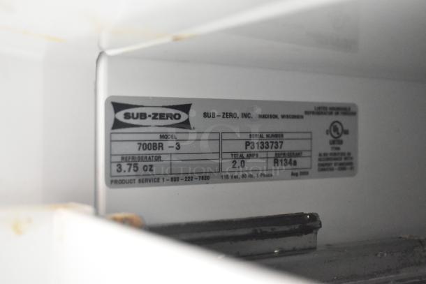 Sub-zero 700BR-3 cooler/freezer label showing model, serial number P3133737, 115V, 1 phase, refrigerant R134a.