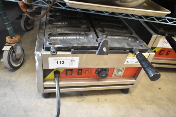 A Piece of Gayke NP-229 stainless steel waffle maker, commercial countertop model. 110 volts, 1 phase. Visible control knobs and power switch.