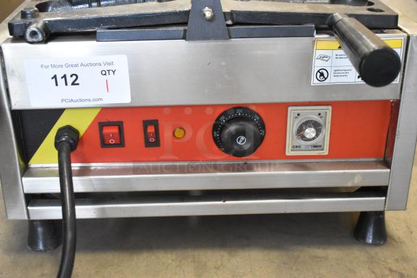 A Piece of Gayke NP-229 stainless steel commercial waffle maker, 110 volts, 1 phase, with temperature controls and power switch.