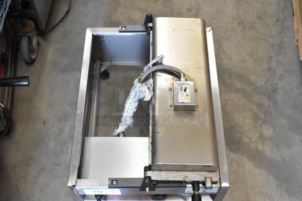 A Piece of Gayke NP-229 stainless steel commercial countertop specialty waffle maker, 110 volts, 1 phase, visible wiring.