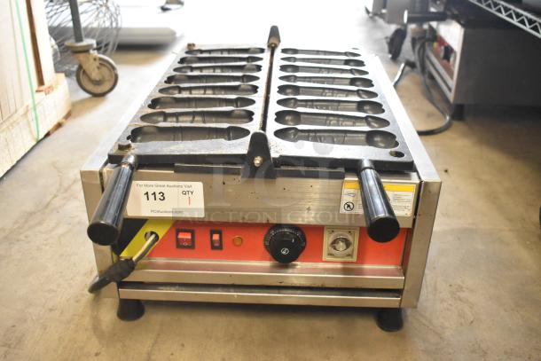 A Piece of Gayke NP-229 stainless steel waffle maker, 110 volts, countertop, dual handles, visible control panel, auction tag.