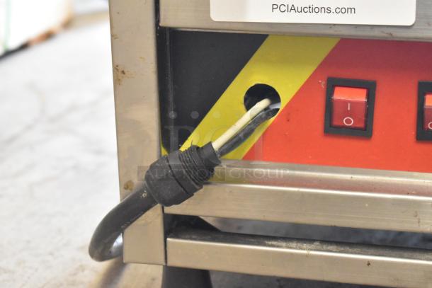 A Piece of Gayke NP-229 stainless steel waffle maker, 110V, 1 Phase; shows power cord and red on/off switches.