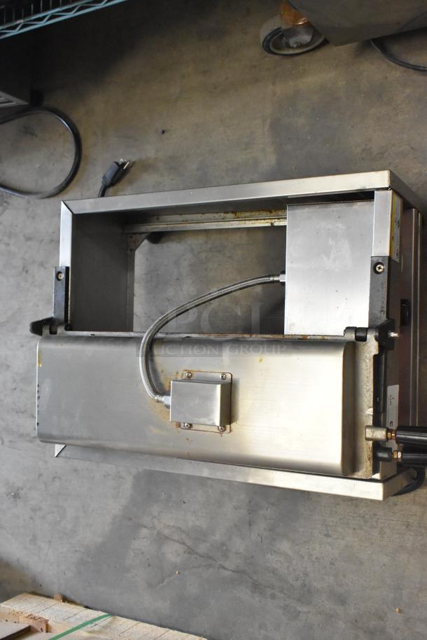 A Piece of Gayke NP-229 stainless steel waffle maker, 110V, 1 phase, commercial countertop, visible power cord, slight wear.