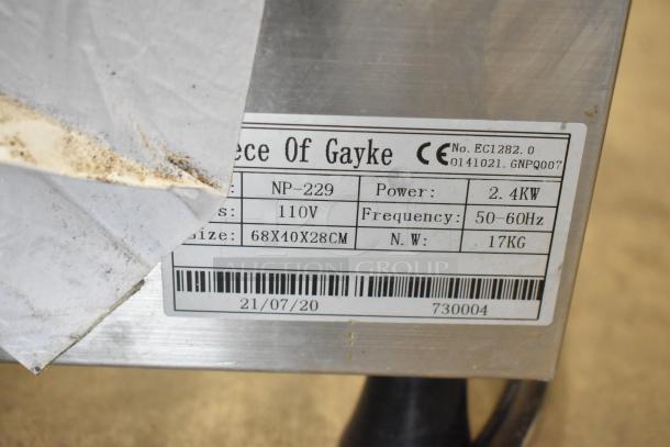 A Piece of Gayke NP-229 stainless steel waffle maker, 110V, 1 phase, commercial countertop model. Visible label shows specs.