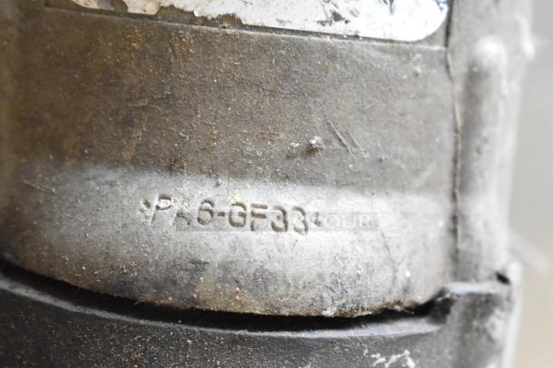 Close-up of a jigsaw with visible label "PA6-GF33". Used condition. 115 volts, 1 phase. Body shows wear.