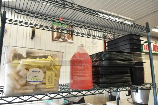 Metro auction lot with poly bins, red liquid container, black trays, and stainless steel bins. Shelving unit not included.