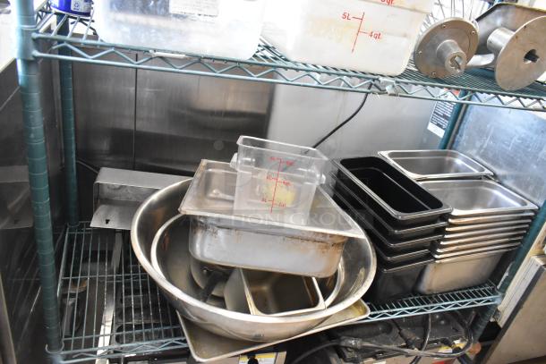 Metro lot including poly bins, drop-in bins, mixer attachments, stainless steel bins on shelves. Does not include shelving unit.