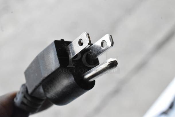 Close-up of a standard power plug, part of the Dukers DUC72R commercial undercounter cooler, 115 volts, 1 phase.