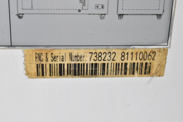Label on Kelvinator KCCF210WH chest freezer, showing PNC & Serial Number: 738232 8110062.