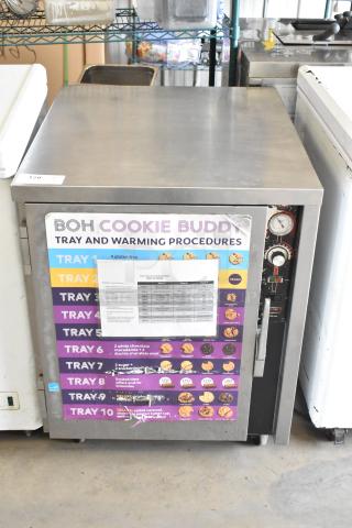 FWE TS-1826-7UC Stainless Steel Heated Holding Cabinet, 115V, on casters. Features control panel and tray procedure signage.