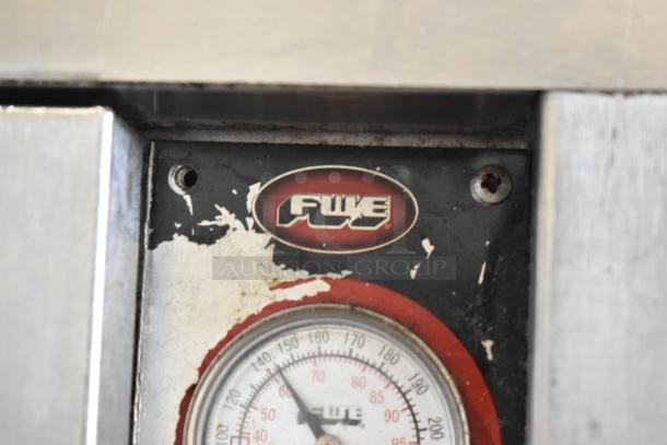 FWE TS-1826-7UC stainless steel heated holding cabinet, visible wear, model label, thermometer, on commercial casters.