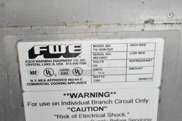 FWE TS-1826-7UC stainless steel heated cabinet label showing model, serial number 08214651, 115V, 1 phase, 11 amps, 1300 watts.