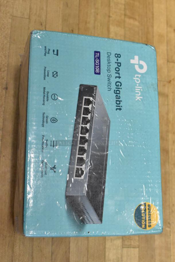 TP-Link TL-SG108 8-Port Gigabit Switch, new in box. Features: plug and play, metal housing, energy-saving design.