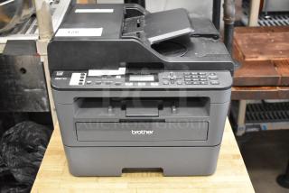 Brother MFC-L2710DW copier scanner printer, visible control panel, used condition. Model and brand markings on front.